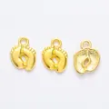 Three gold vintage zinc alloy baby feet charms with hanging loops for DIY jewelry making - Gold