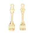 Macro detail of pair of vintage gold-plated zinc alloy fork pendants for DIY jewelry making - Vintage Fork Style / Gold
