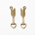 Pair of vintage bronze alloy bow and arrow pendants with heart tips for DIY jewelry making - Antique Bronze