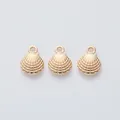 Close-up of three gold shell pendants with radial textures and integrated top loops - Light Gold (KC)