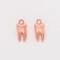 Detailed view of rose gold molar tooth alloy charms with a polished finish and top ring - Rose Gold