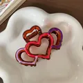 Amber heart claw clip with layered colorful resin stripes on a ceramic tray - Triple Heart Amber Contrast Style (F1709 Pink Purple)