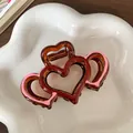 Dual heart-shaped hair claw clip in transparent brown with subtle pink edge accents - Double Heart Overlap Transparent Brown Pink Edge (F1709 Red Pink)