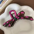 Brown bow hair claw clip with pink polka dots and green accent in a ceramic dish - Bow Dark Brown Pink Purple Dot Style (F1720 Pink Purple)