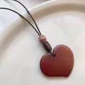 Polished reddish-brown heart pendant necklace with natural wooden beads and woven cord - Smooth Heart Style (X2017 Irregular Heart)