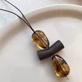 Retro geometric necklace featuring amber resin teardrop pendants on brown leather cord - Amber Geometric Style (X2017咖)