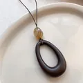 Long brown oval pendant necklace with yellow bead detail on minimalist thin cord - Dark Brown Oval Style (X2017 Teardrop)