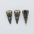 Vintage bird skull alloy pendants for DIY jewelry with antique bronze finish and hollow back - Antique Bronze