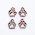Vintage red copper zinc alloy bear paw pendants in a set of four on white background - Antique Red Copper