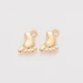 Macro shot of two polished gold baby foot charms for DIY jewelry making accessories - KC Gold