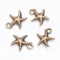 Set of four vintage alloy starfish charms in antique bronze finish with loop for DIY jewelry - Antique Bronze