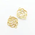 Detail of two golden hollow camellia flower connectors with double loops for DIY jewelry - Gold