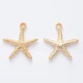 Detailed macro shot of vintage gold starfish alloy charms for DIY jewelry making and crafts - KC Gold