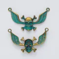 Pendentifs tête de mort ailée en cuivre vintage avec patine verte pour bijoux artisanaux - Vert Antique