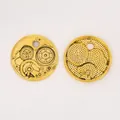 Detail of vintage steampunk gear pendants in gold finish for DIY jewelry crafts - Antique Gold