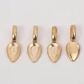 Close-up of four teardrop-shaped gold alloy jewelry bails with polished metallic finish - KC Gold
