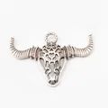 Vintage silver bull skull pendant in zinc alloy with hollow design and textured horns - Antique Silver