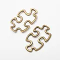 Retro bronze puzzle-shaped alloy connectors for DIY jewelry and necklace crafts - Antique Bronze