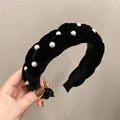 Detail view of handmade black velvet braided headband with elegant white pearls - Black Velvet Braided Pearl Style