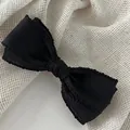 Elegant black fabric bow hair clip with decorative wavy lace edges for women - Black / Spring Clips