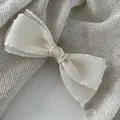 Elegant cream-colored double-layered ribbon bow hair clip with textured polka dot edges - Milky White / Spring Clips
