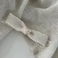 Cream white ribbed ribbon hair clip with delicate lace edges on woven burlap - Milky White / Duckbill Clip
