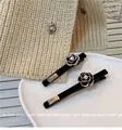 Detail of camellia hair clips with pearls on a ceramic tray with a knit background - 6cm / Black (With Diamonds)
