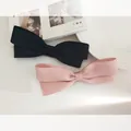 Detail of pink and black satin bow hair clips in a pair with elegant fabric texture - Double Layer Satin Big Bow / Pink