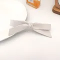Elegant cream white matte leather bow hair clip with clean edge stitching for women - Leather Texture / Off White