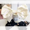 Oversized satin bow hair clips in black and white with pearls and queen metal charms - Oversized Pearl Bow Coin Pendant / Off White