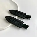 Lot de deux barrettes à cheveux noires minimalistes avec texture cuir élégante - Noir