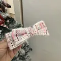 Detail of pink and purple tweed bow headband with soft fringed edges and woven texture - Pink And White Tweed Bow Hair Clip