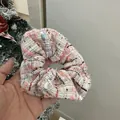 Detail of pink tweed headband with woven texture and subtle fringe edge design - Pink And White Tweed Scrunchie