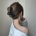 Elegant matte black large hair claw clip for long hair styling in minimalist design - Crisscross Large / Black