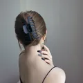 Large matte black hair claw clip for thick hair shown on a female model - Keel Wave Style / Black