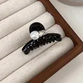 Elegant mini black hair claw clip with white pearl and sparkling crystal on wood tray - Black Heart Pearl