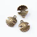 Vintage bronze shell charms for DIY jewelry making featuring intricate textures - Antique Bronze