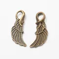 Pair of antique bronze alloy wing charms with detailed feather textures for DIY jewelry - Antique Bronze