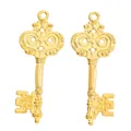 Pair of vintage gold zinc alloy key pendants with ornate scrollwork on white background - Gold