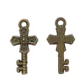 Vintage bronze alloy cross key pendant charms with embossed details on white background - Antique Bronze