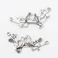 Connecteur de bijoux oiseau vintage en argent sur branche fleurie avec doubles boucles - Argent Antique