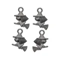 Macro detail of four vintage silver wizard bunny charms with witch hats and brooms - Gun Black
