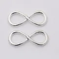 Set of two vintage silver alloy infinity symbol connectors for DIY jewelry making - Antique Silver