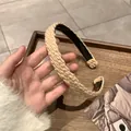 Knitted beige headband with braided twist texture for a stylish vintage autumn winter look - Light Coffee