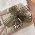 Elegant dark green mesh bow hair ring with silver spiral coil and pearl accent - Green