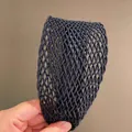 Detailed close-up of dark woven wide headband with hollow mesh texture and 3D layering - Black