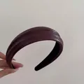 Detail of dark burgundy wide leather headband showing unique crinkled texture and soft lining - Synthetic Leather Natural Pleated Style / Burgundy