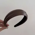 Detail of wide dark brown faux leather headband with unique embossed rock texture and black lining - PU Leather Cracked Rock Texture Style / Brown