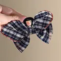 Classic navy plaid fabric bow hair claw clip with red wavy stitching and sturdy grip - Plaid Claw Clip