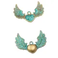 Vintage wing heart metal pendant with antique bronze finish and verdigris detail - Antique Green
